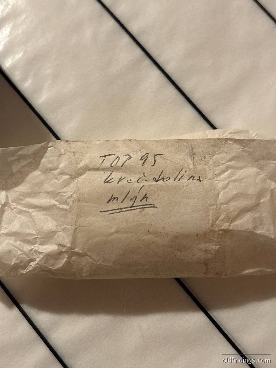 Handwritten label on crumpled paper: "TOP 95 Kred Solina m1gh." Suggests a vintage or collectible item, likely related to **Kred Solina**—a Polish audio equipment brand. The "m1gh" may indicate a model or variant. Paper texture indicates age or archival quality.