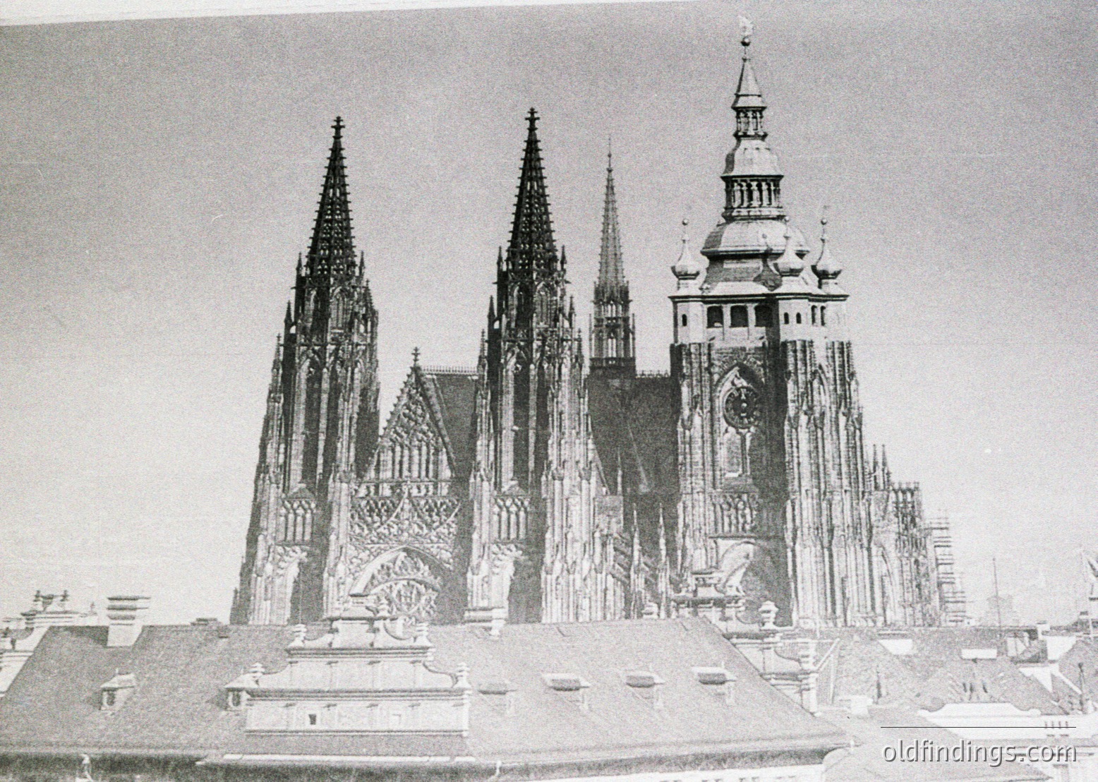 Gothic cathedral with intricate spires and towering façade, likely Wawel Cathedral in Kraków, Poland. Constructed in the 14th–16th centuries, showcasing pointed arches, ornate tracery, and a central clock tower. *(Note: The date "1818" visible in the lower right appears to be a watermark or unrelated annotation, not part of the building’s construction timeline.)*