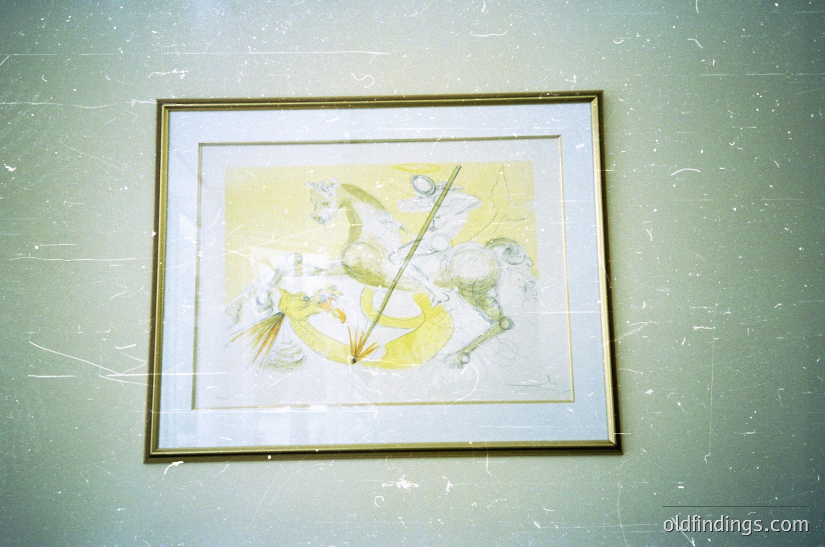 Abstract ink-and-watercolor composition featuring dynamic, organic forms in muted yellows and whites. Central vertical line contrasts with fluid, swirling elements resembling marine life or celestial motifs. Framed in gold-leaf trim against textured green wall, evoking mid-century modern or avant-garde art. Potential inspiration for interior design or contemporary illustration.