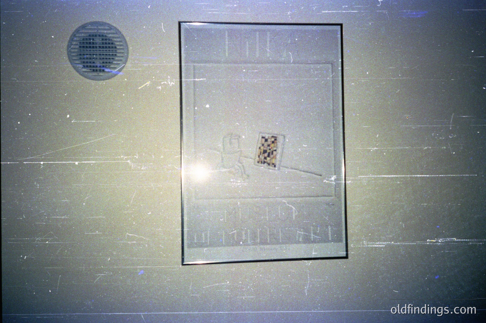 Vintage glass plaque featuring a stylized skier with a checkered flag, likely commemorating alpine sports. Engraved text reads "Ski Club Olimpijski," suggesting a connection to Olympic skiing. Circular ventilation grate in top-left corner. Likely from a public building or sports facility in a Cold War-era Eastern Bloc country.