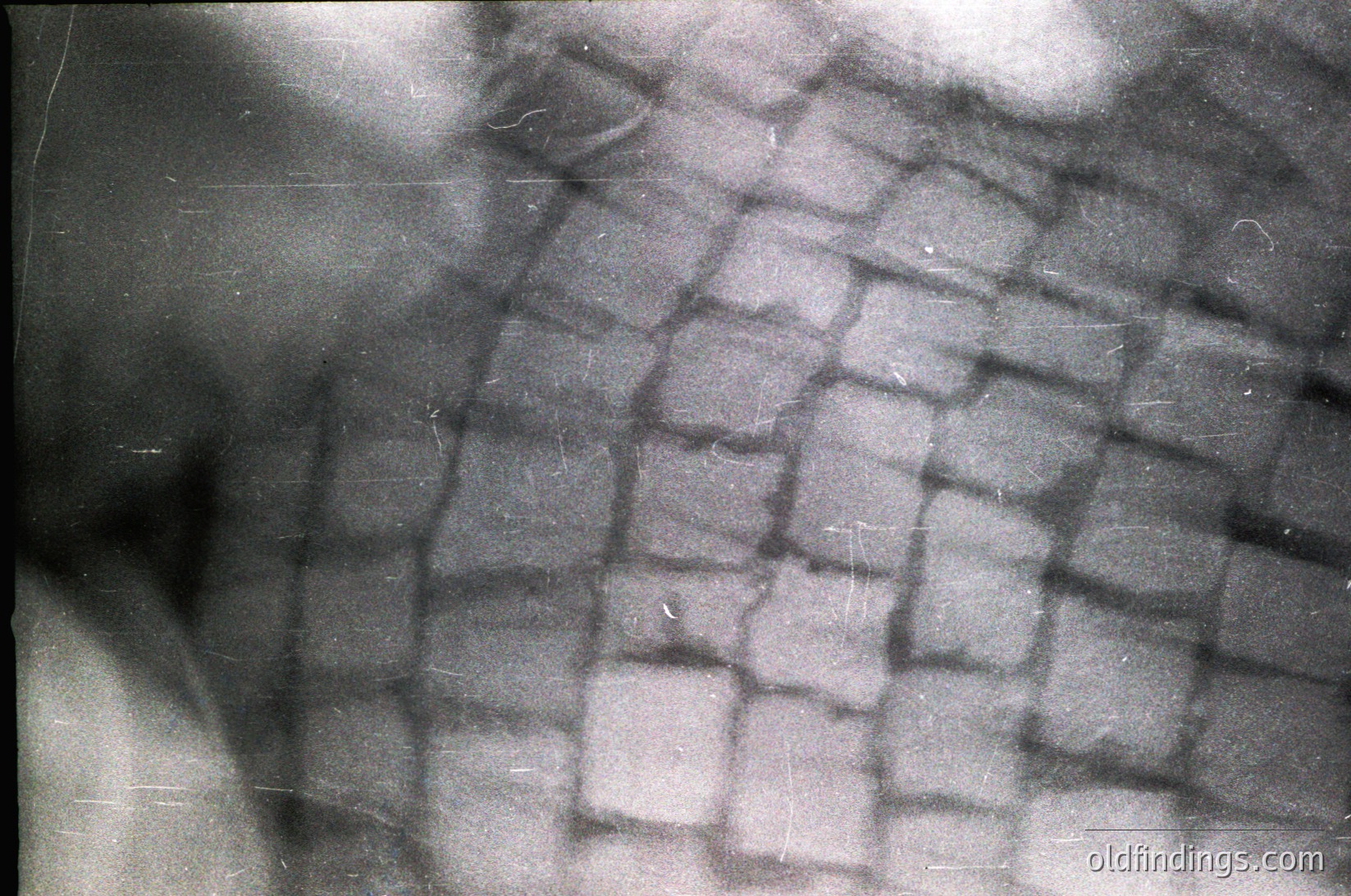 Close-up of a **herringbone-patterned stone wall**, likely part of historic masonry. The interlocking V-shaped cuts suggest 19th–20th century construction techniques. Ideal for architectural studies or period design references.
