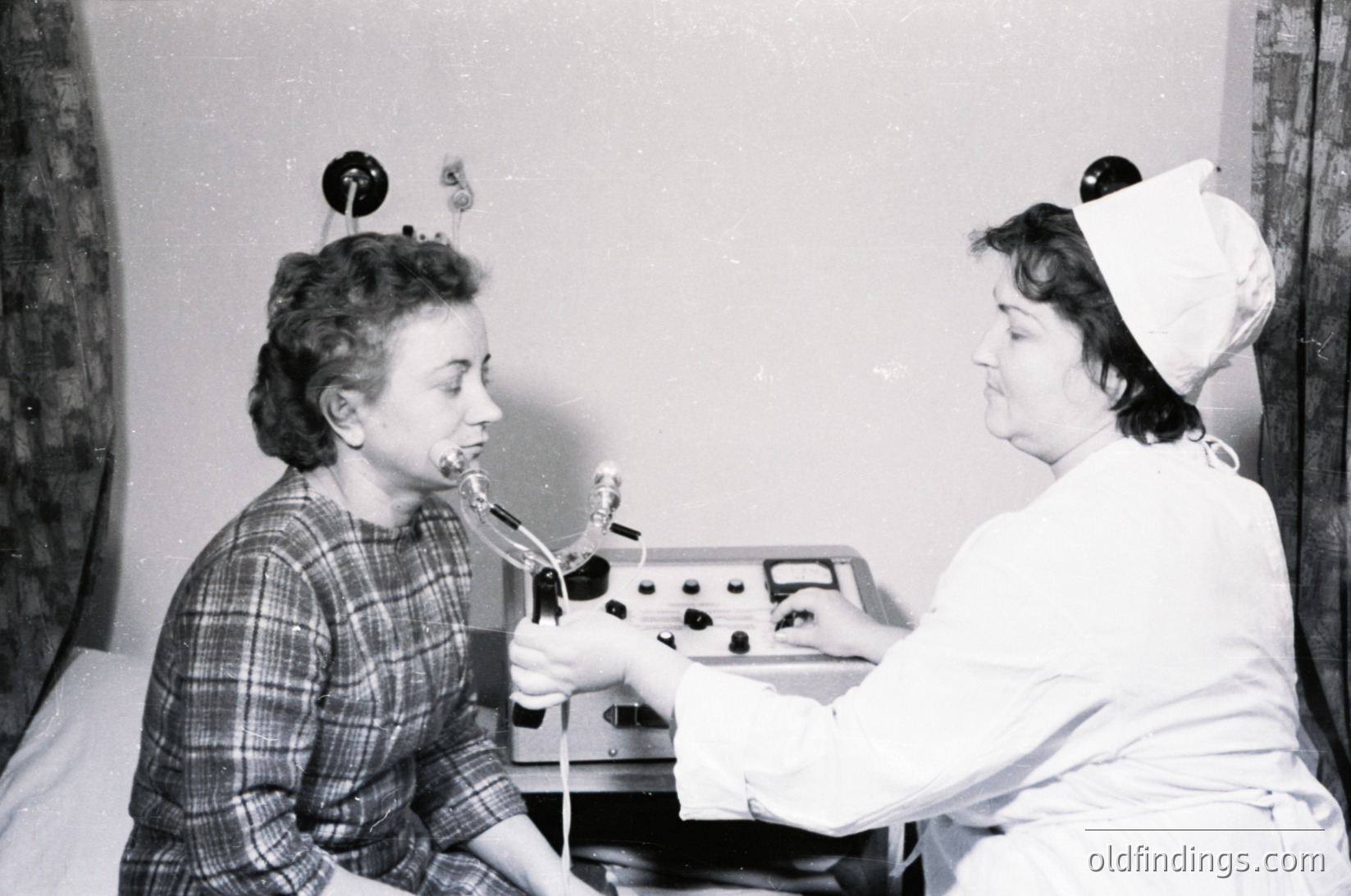 Mid-20th century dental clinic scene: female patient seated with mouth open, receiving treatment via early electric dental drill. Nurse in white cap and uniform assists. Plain exam room with basic lighting. Reflects 1950s–1960s dental hygiene practices.
