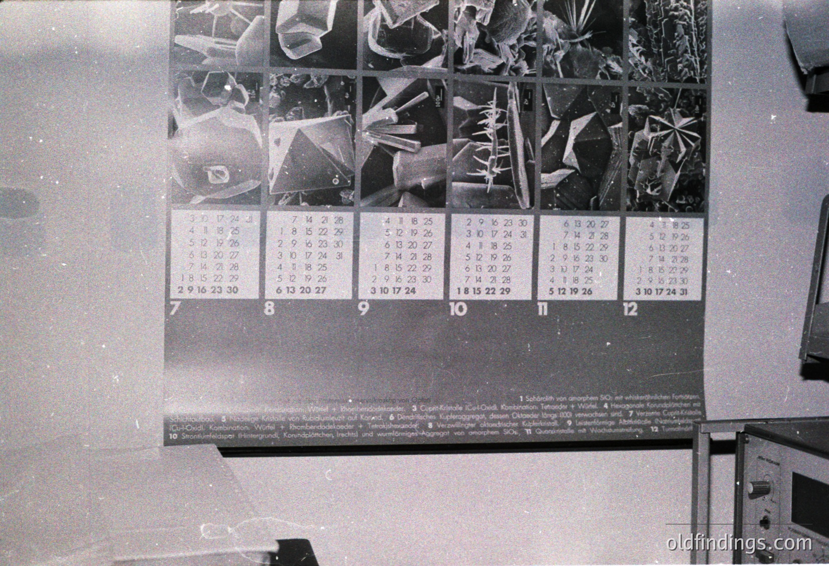Vintage 1960s–70s wall calendar featuring close-up X-ray images of hands, fingers, and bones. Each month displays skeletal variations, likely for medical education or orthopedic reference. Industrial setting with partial text in German.