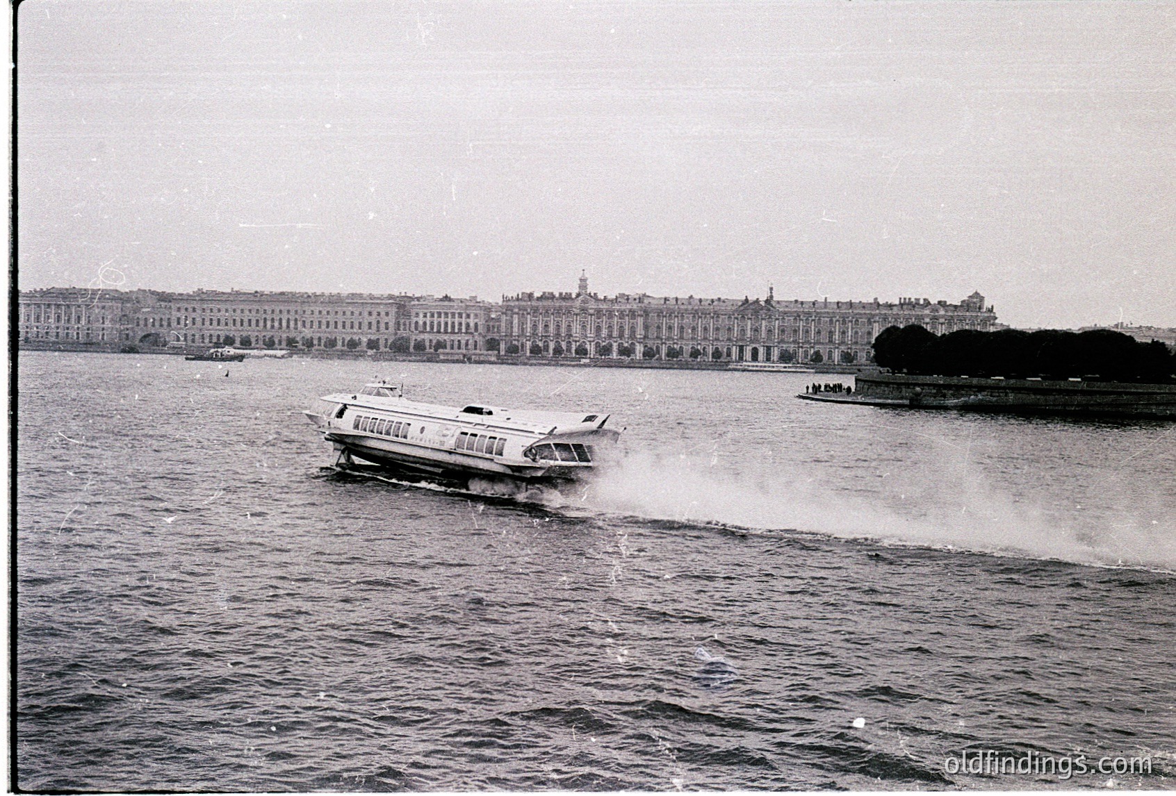 Where is this: a vintage black-and-white photo of a high-speed passenger boat cutting through