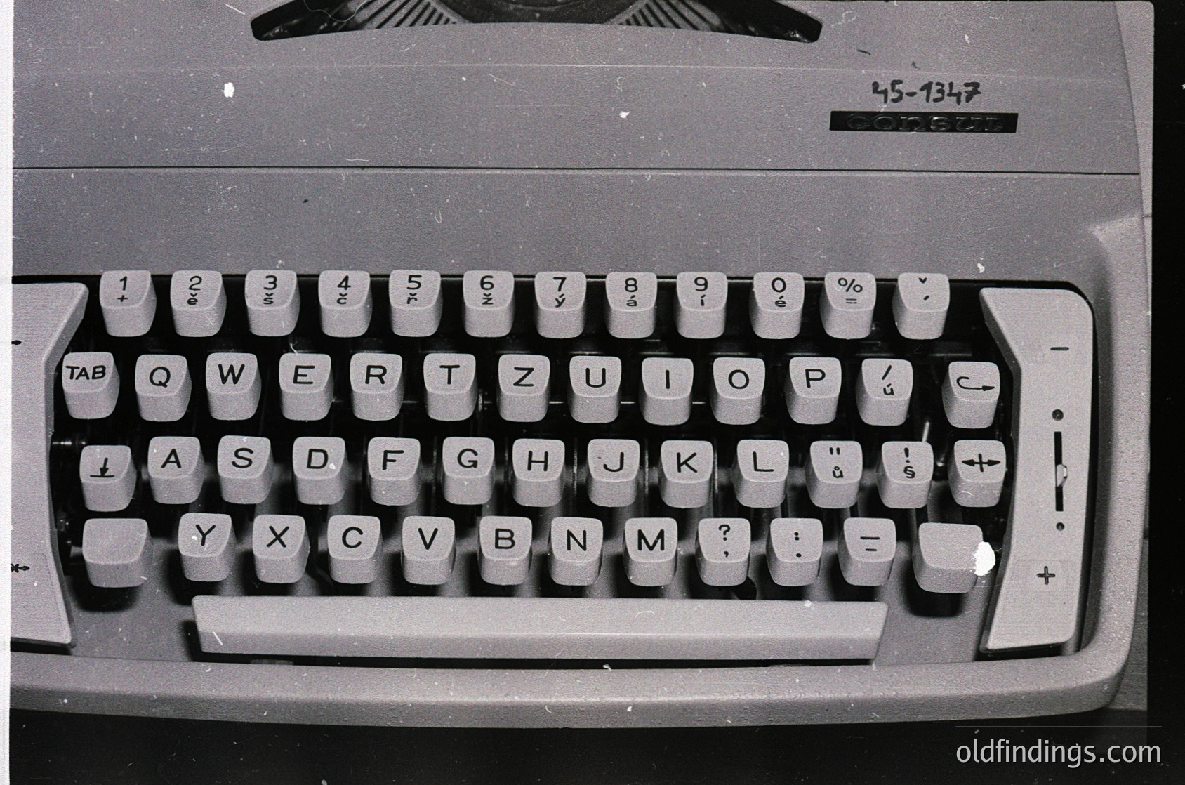 Vintage electric typewriter with QWERTY layout, featuring Cyrillic characters and numeric keypad. Model -1347 suggests Eastern European origin, likely 1960s–1980s. Ideal for retro tech, historical research, or office nostalgia.