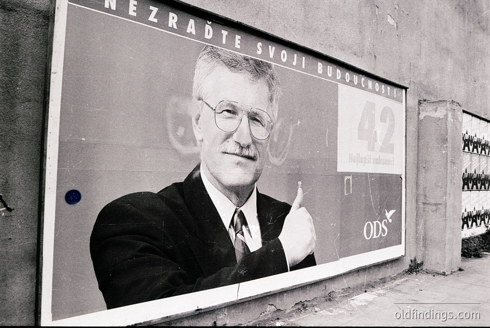Vintage political campaign poster featuring a man in a suit, gesturing with his right hand. Text in Czech: *"Nezraďte svoji budoucnost"* ("Don’t shame your future") with "42" and "ODS" (Civic Democratic Party) branding. Urban setting, likely 1990s Czech Republic. --- *Note: "Czech Republic" inferred from text and party branding; "1990s" based on style and political context.*
