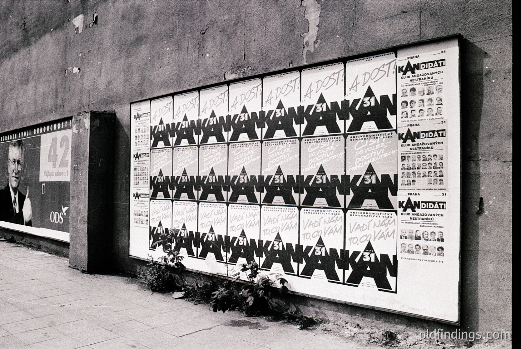 Vintage election poster board featuring repeated candidate name "Анастасова" in bold Cyrillic, arranged in a grid with small portraits and party logos. Signs of wear and graffiti. Likely Bulgaria, 1980s–1990s era.