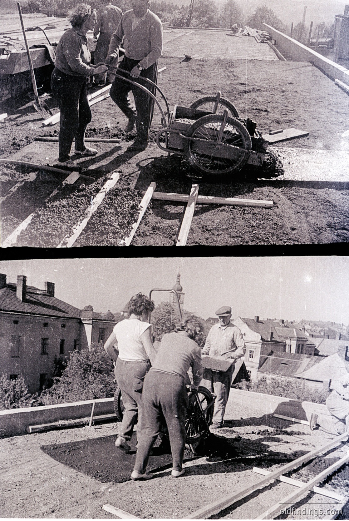 Mid-20th century urban construction crew using a manual asphalt roller on a freshly paved roadway. Workers in casual workwear (overalls, caps) operate machinery in a residential area with visible houses and trees.