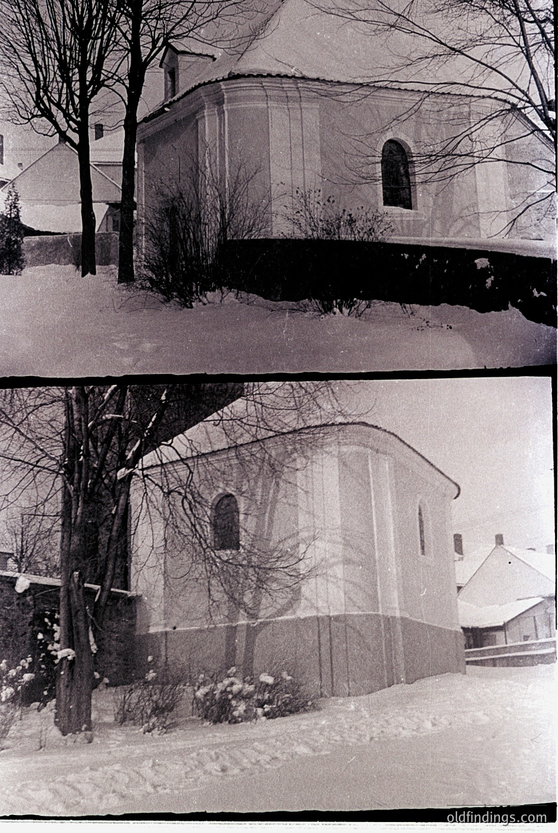 Vintage sepia-toned photo of a small, rounded church with a single arched window, partially buried in snow. Leafless trees and residential buildings flank the structure, suggesting a quiet winter scene. Likely Eastern European architecture, mid-20th century.