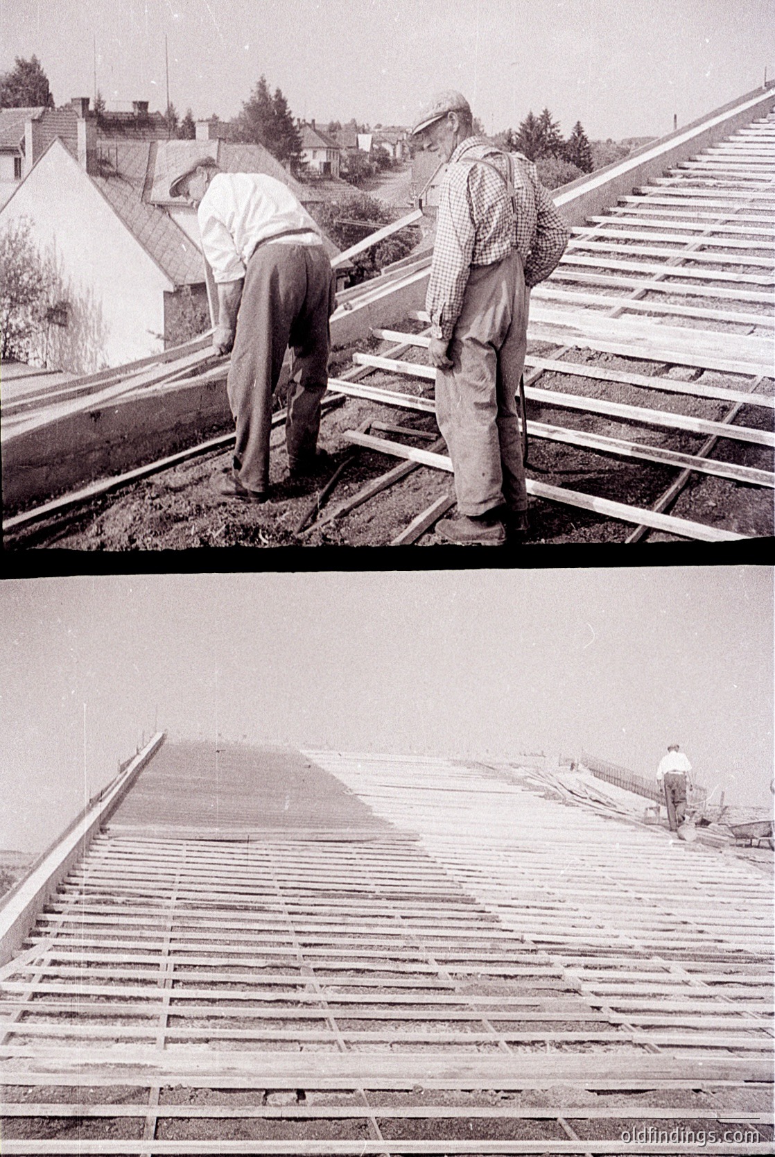 Two workers installing wooden shingles on a sloped roof, mid-20th century. The scene captures manual labor techniques with wooden planks and nails. Residential houses and greenery visible in background.
