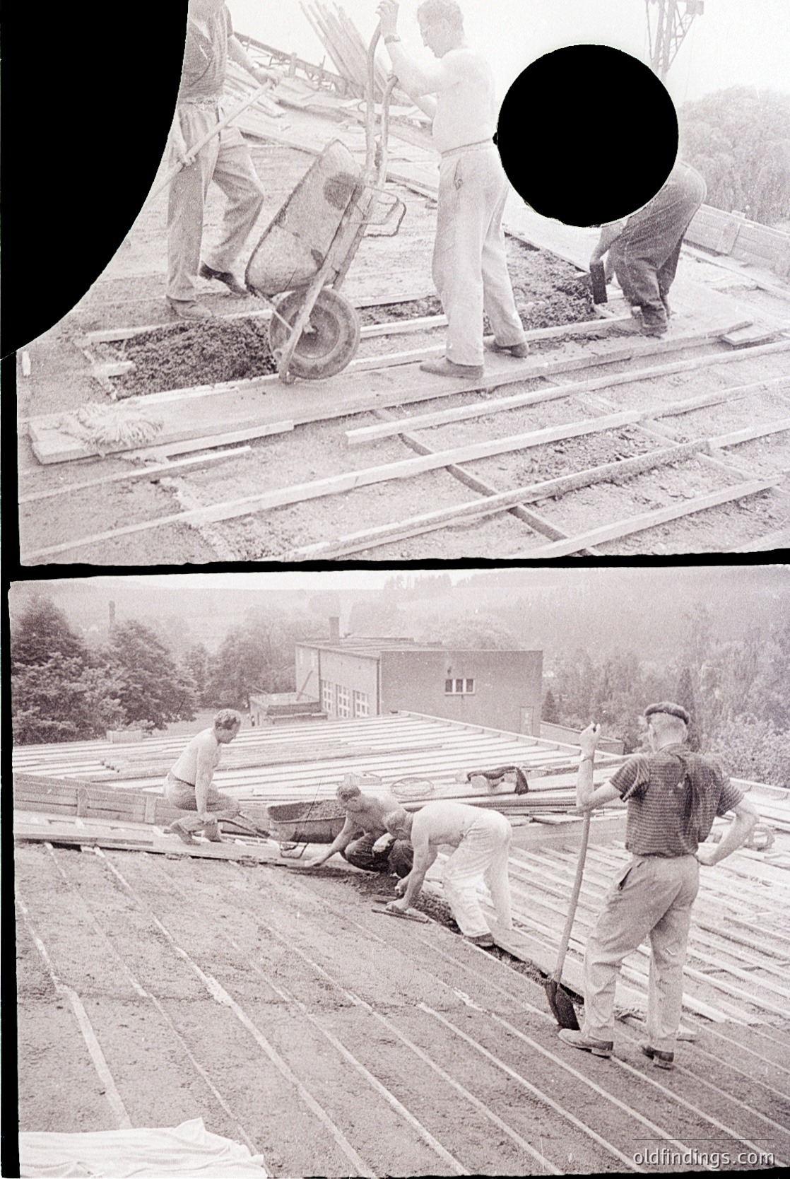 Vintage black-and-white construction site featuring manual laborers laying wooden planks on a foundation. Workers in rolled-up sleeves and caps use shovels and wheelbarrows, indicating mid-20th century industrial practices. Nearby, a small residential building with white walls and a pitched roof suggests residential construction.