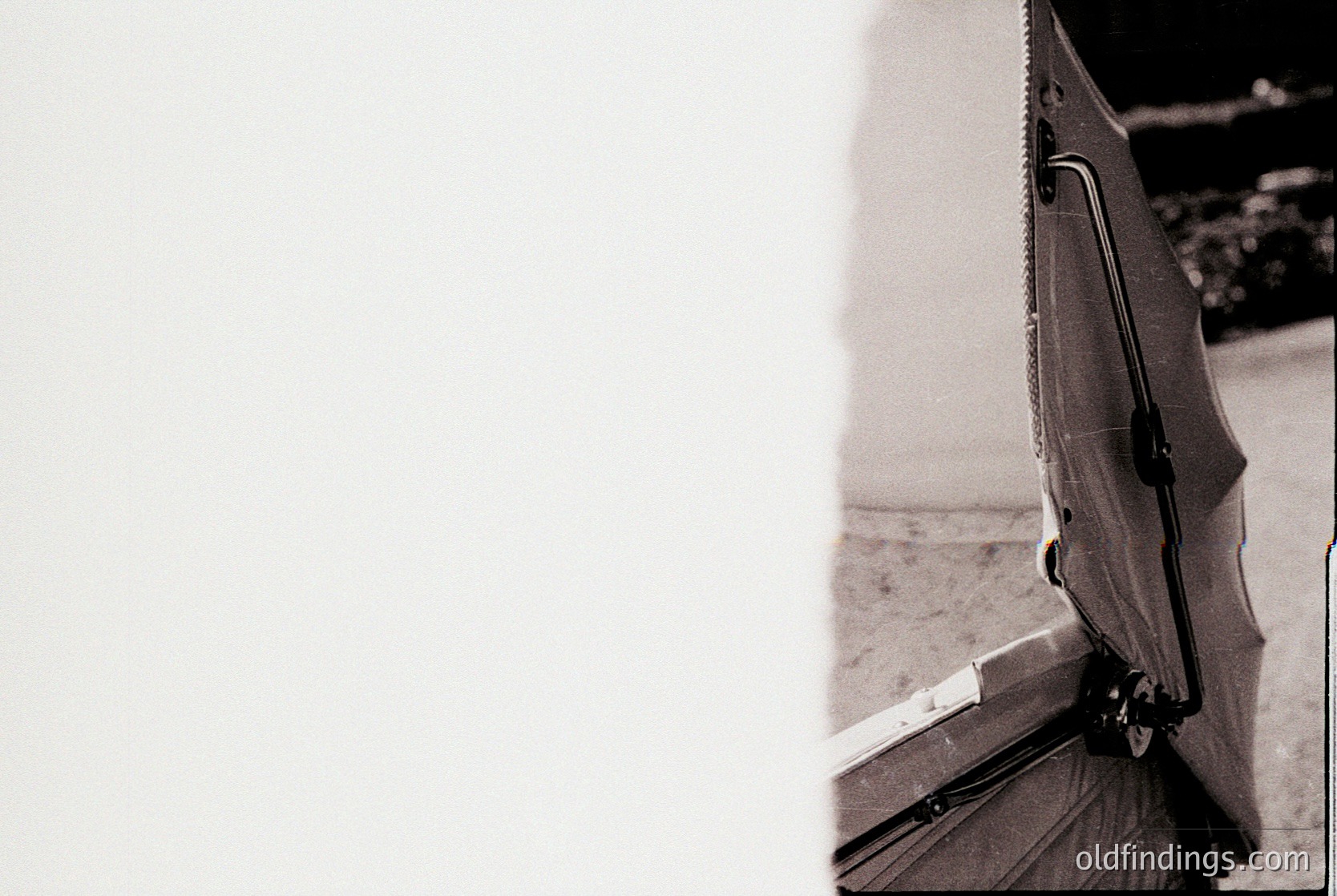 Close-up of a vintage **guitar pickguard** with a **black plastic or resin finish**, featuring a **screw-on mounting system** and **metal rivets**. The design suggests a **1960s–1970s** electric guitar component, likely for **rock or blues** genres. The worn edges indicate frequent use.