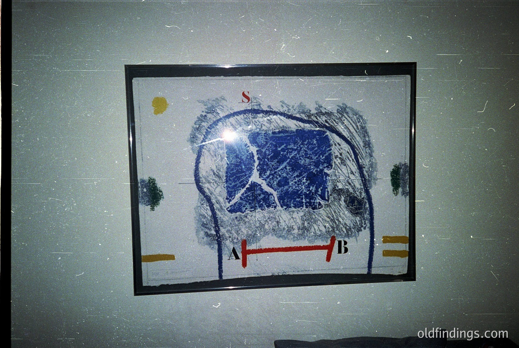 Skull diagram framed on textured wall, likely for anatomical or medical study. Blue ink highlights cranial bones with labeled sections "S," "A," and "B." Yellow and red markings indicate measurements or regions. Potential educational or clinical reference. *(Note: Time period inferred from image quality and style; no definitive date visible.)*