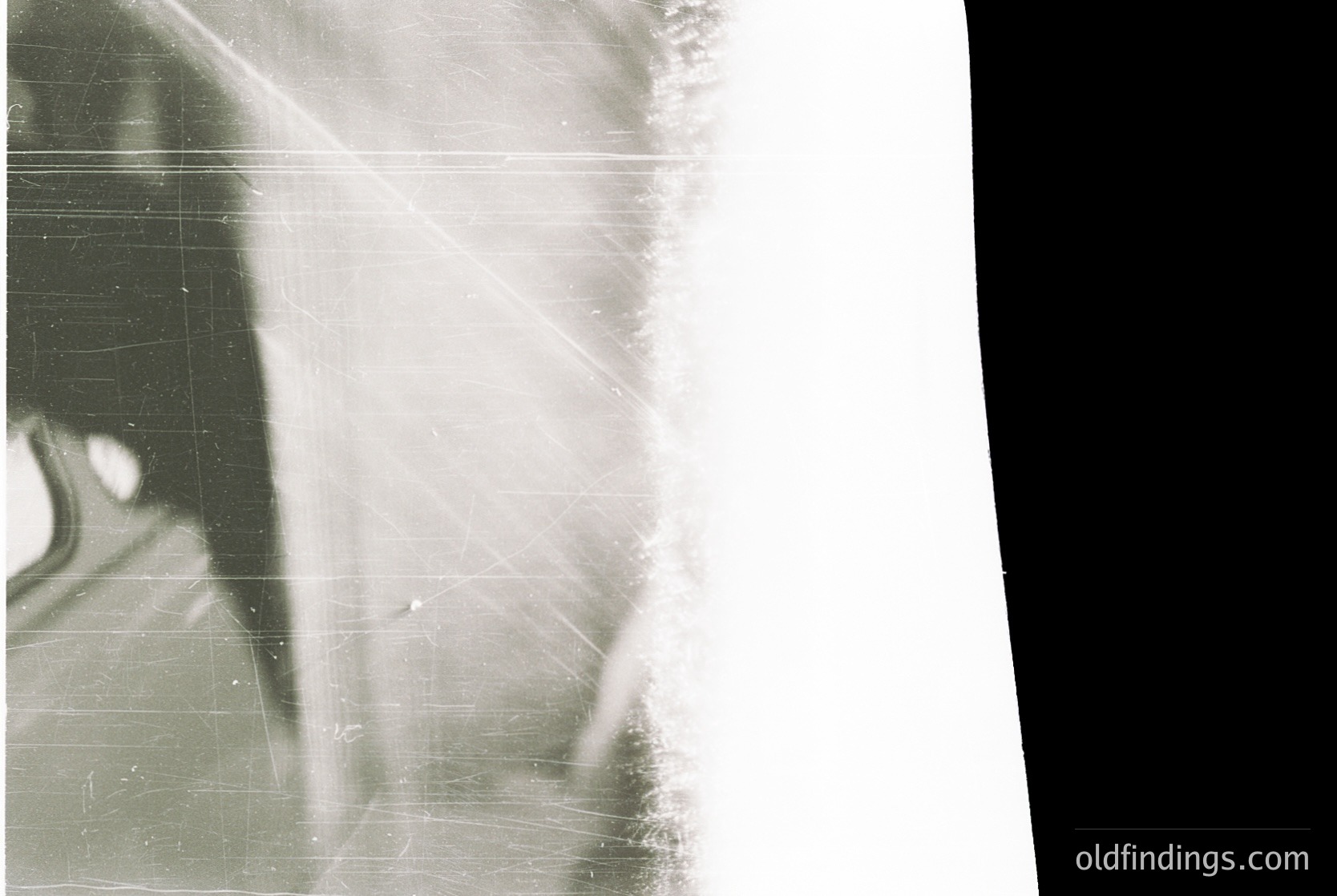 Vintage sepia-toned close-up of a person’s profile, partially obscured by scratches and fading. Likely a mid-20th century portrait, possibly , showing textured paper damage. Ideal for , , , , . *(Note: Due to low detail, specific location or identity cannot be determined.)*