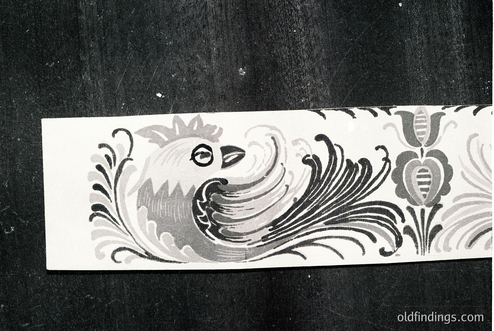 Vintage decorative tile fragment featuring a stylized peacock in monochrome relief, surrounded by floral motifs. Likely 19th–early 20th century European ceramic art. Ideal for historical research or vintage design references.