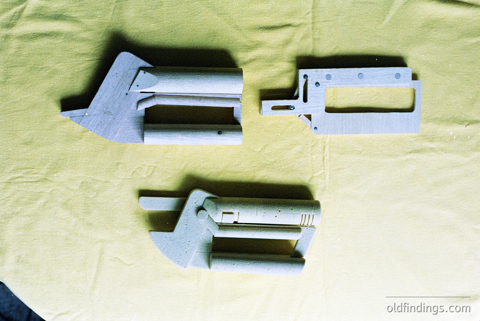 Industrial metal brackets with angled, bolted joints—likely for structural or mechanical assembly. Appears mid-20th century, possibly –. Suitable for engineering, architecture, or industrial design references.