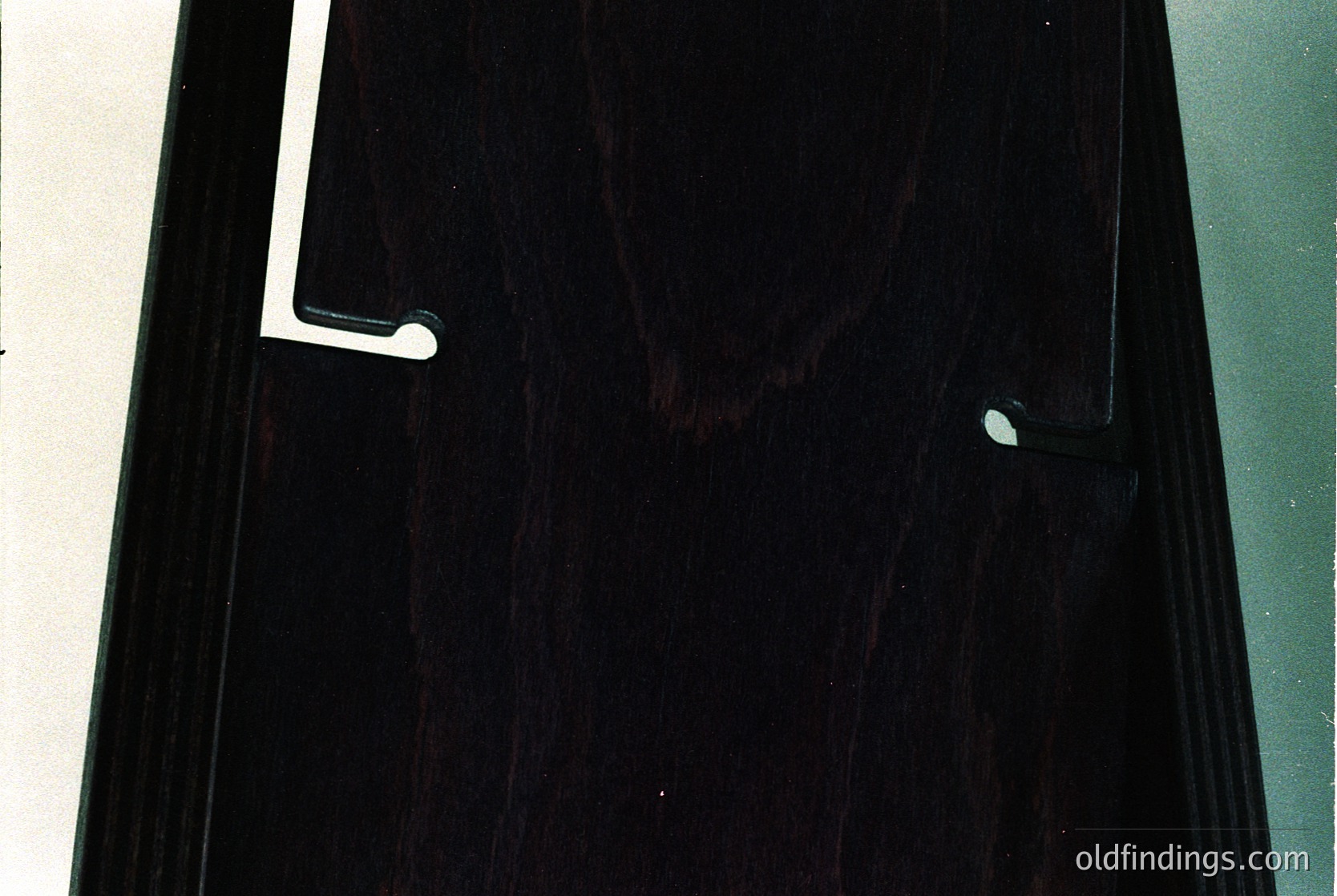 Close-up of a vintage black vinyl record sleeve, featuring a white label with embossed text and a circular logo. The design suggests mid-20th century pop/rock era. Ideal for music history or retro design references.