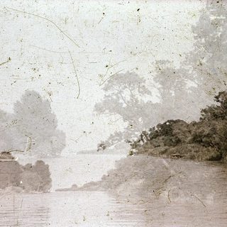 Vintage photograph of foggy coastal landscape.