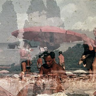 Vintage beach scene with people relaxing and sunbathing.
