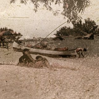 Vintage photo of rural landscape with old boat.