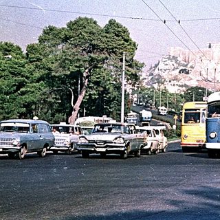 Vintage trolley bus in urban street scene.