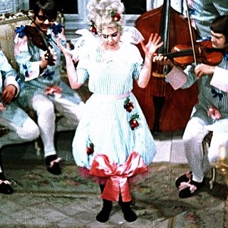 Eighteenth-century woman dancing with classical musicians.