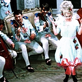 Eighteenth-century woman dancing with classical musicians.