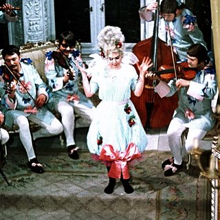 Eighteenth-century woman dancing with classical musicians.