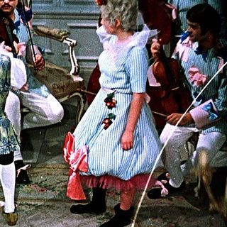 Ballroom dance performance with vintage costumes.