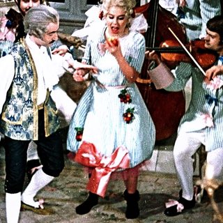 Eighteenth-century costume dance with string musicians.