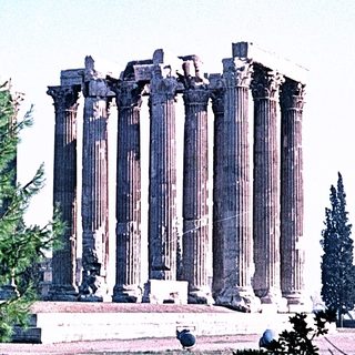 Ancient Greek temple ruins with tall columns.