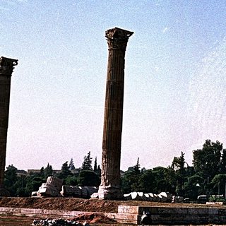 Ancient Greek ruins with standing columns.