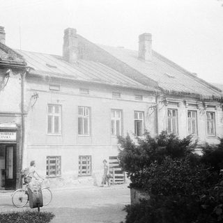 Vintage street scene with old building and bicycle.