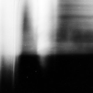 Blurred vertical lines on dark background.