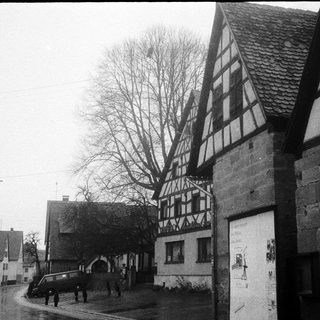 Traditional half-timbered houses in a quiet village street.
