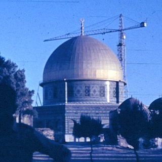 Dome of the Rock illuminated at dusk.