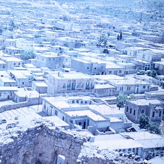 Historic town nestled in mountainous terrain.
