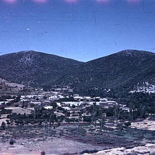 Rural village nestled in mountainous terrain.