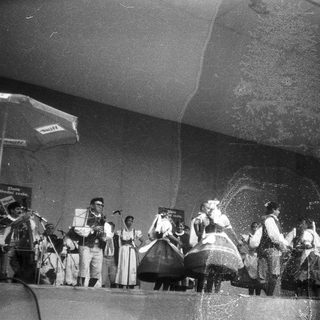Traditional folk dance performance with musicians.