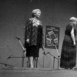 People on stage during an event or gathering.