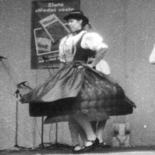 Traditional folk dance performance on stage.