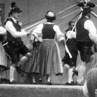 Traditional folk dance performance with musicians.