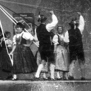 Group performing traditional rope dance on stage.