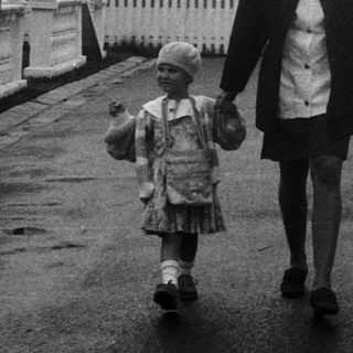 Family walking near family housing complex.