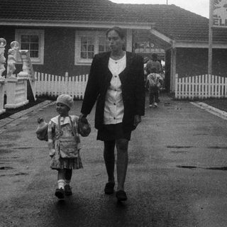 Family walking near family housing complex.