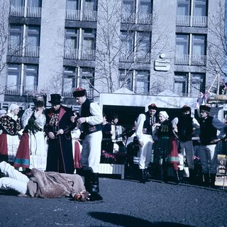 Traditional folk performance with costumed dancers and musicians.