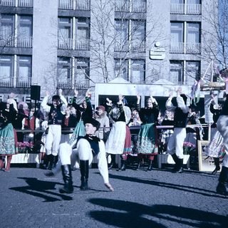 Traditional folk dance parade with colorful costumes.