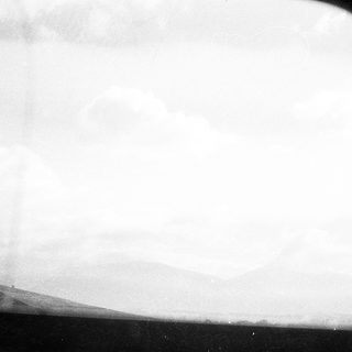 Blurry view through airplane window.