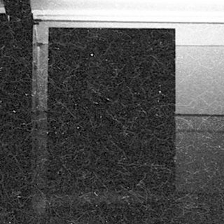 Flooded indoor area with graffiti map.