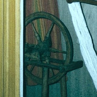 Maritime museum display with helm, ropes, and wheel.